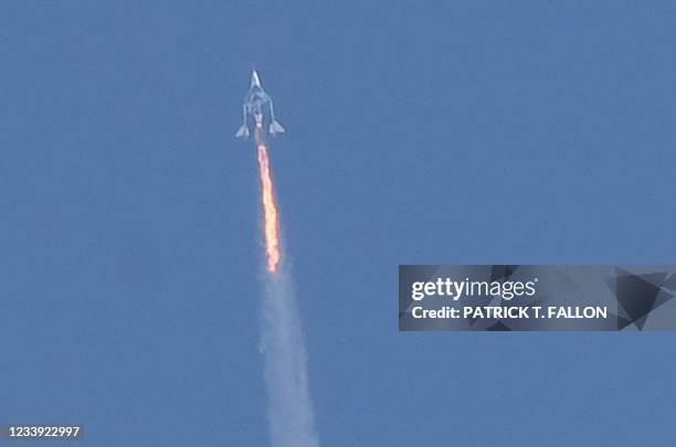 The Virgin Galactic SpaceShipTwo space plane Unity and mothership separate as they fly way above Spaceport America, near Truth and Consequences, New...
