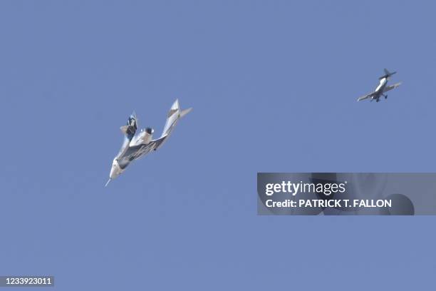 The Virgin Galactic SpaceShipTwo space plane Unity and mothership separate as they fly way above Spaceport America, near Truth and Consequences, New...