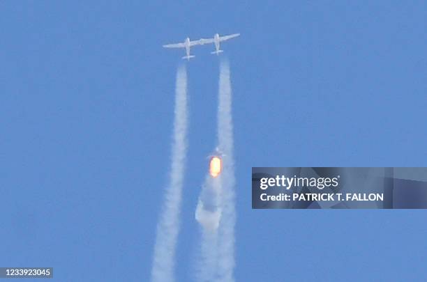 The Virgin Galactic SpaceShipTwo space plane Unity and mothership separate as they fly way above Spaceport America, near Truth and Consequences, New...