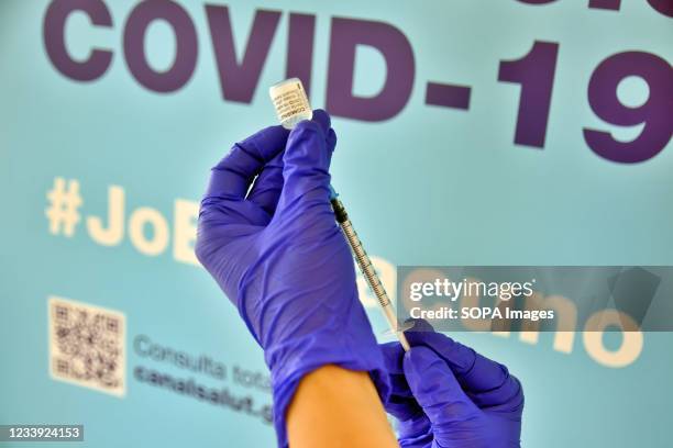 Health worker prepares a syringe with the Comirnaty COVID-19 mRNA Vaccine at the Calafell Vaccination Center. The Department of Health of Catalonia...