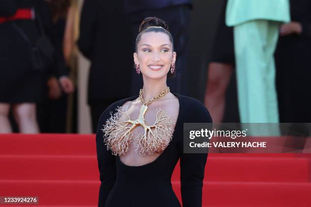 Model Bella Hadid poses as she arrives for the screening of the film "Tre Piani" at the 74th edition of the Cannes Film Festival in Cannes, southern...