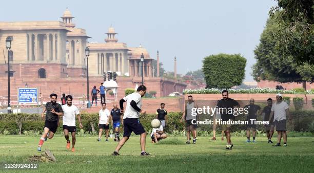 People playing football at Rajpath during a hot day, on June 11, 2021 in New Delhi, India. (Photo by Arvind Yadav/Hindustan Times via Getty Images