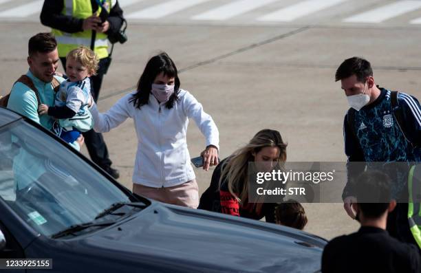 Argentina's Lionel Messi and teammate Giovani Lo Celso are are seen next to Argentina's Angel Di Maria's wife Jorgelina Cardoso and Lo Celso's...