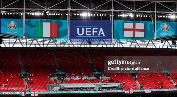 July 2021, United Kingdom, London: Football: European Championship, Italy - England, final round, final at Wembley Stadium. The UEFA logo hangs...