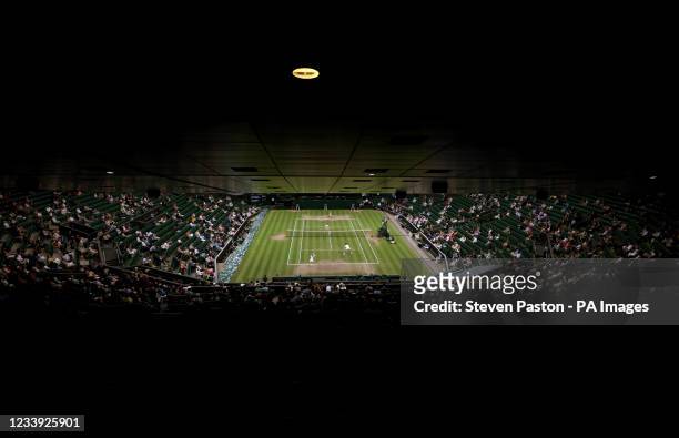 Neal Skupski and Desirae Krawczyk in action against Harriet Dart and Joe Salisbury in the Mixed Doubles Final on Centre Court on day thirteen of...