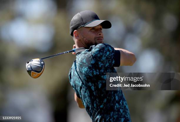 Athlete Steph Curry tees off from the third hole during the final round of the American Century Championship at Edgewood Tahoe South golf course on...