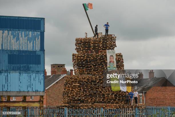 Bonfire decked with Irish tricolours to be burnt prepared for the 11th Night in South of Belfast. The bonfire consists of pallets collected by the...