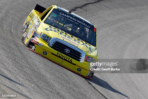 Kyle Busch drives the Dollar General Toyota during practice for the NASCAR Camping World Truck Series Atlanta 200 at Atlanta Motor Speedway on...