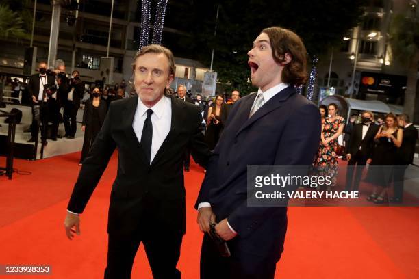 British actor Tim Roth arrives with his son Michael Cormac Roth for the screening of the film "Bergman Island" at the 74th edition of the Cannes Film...