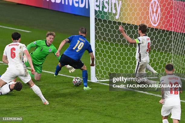 Italy's defender Leonardo Bonucci shoots to score the equaliser during the UEFA EURO 2020 final football match between Italy and England at the...