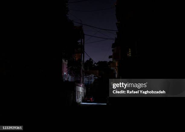 An empty and dark street in the district damaged by the port explosion on July 11, 2021 in Beirut, Lebanon. Lebanon is struggling with severe...