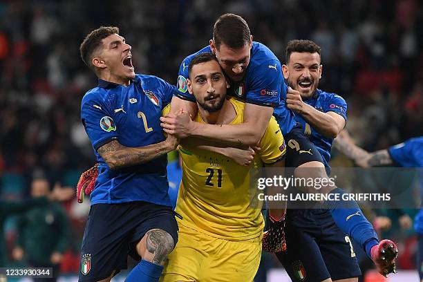 Italy's goalkeeper Gianluigi Donnarumma celebrates with teammates after winning the UEFA EURO 2020 final football match between Italy and England at...
