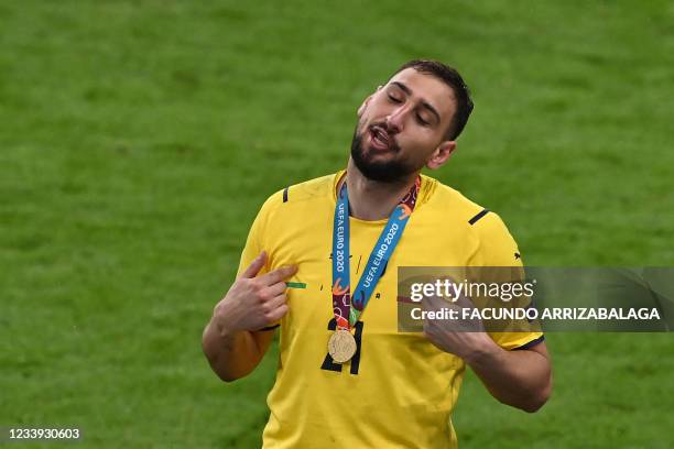 Italy's goalkeeper Gianluigi Donnarumma gestures after Italy won the UEFA EURO 2020 final football match between Italy and England at the Wembley...