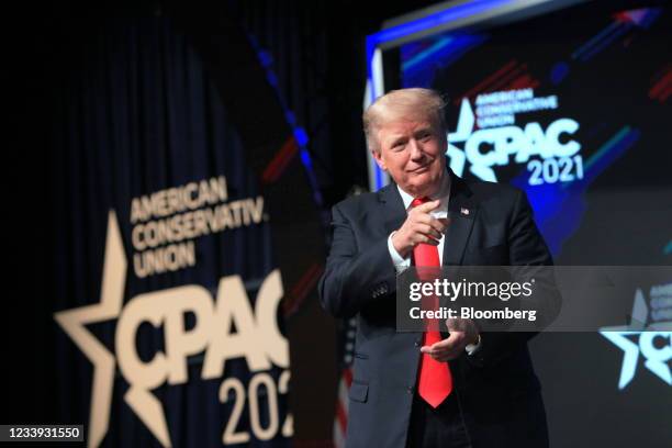 Former U.S. President Donald Trump gestures while arriving to speak during the Conservative Political Action Conference in Dallas, Texas, U.S., on...