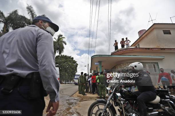 Members of the special military brigade guard the town San Antonio de los Banos after the anti-government protests in which hundreds of people...