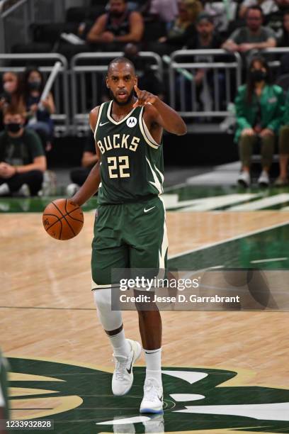 Khris Middleton of the Milwaukee Bucks handles the ball against the Phoenix Suns during Game Three of the 2021 NBA Finals on July 11, 2021 at Fiserv...
