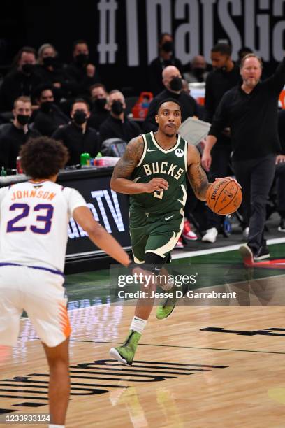 Jeff Teague of the Milwaukee Bucks handles the ball against the Phoenix Suns during Game Three of the 2021 NBA Finals on July 11, 2021 at Fiserv...