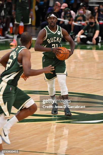 Jrue Holiday of the Milwaukee Bucks passes the ball against the Phoenix Suns during Game Three of the 2021 NBA Finals on July 11, 2021 at Fiserv...