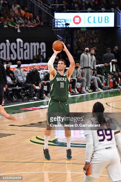 Brook Lopez of the Milwaukee Bucks shoots a three-pointer against the Phoenix Suns during Game Three of the 2021 NBA Finals on July 11, 2021 at...