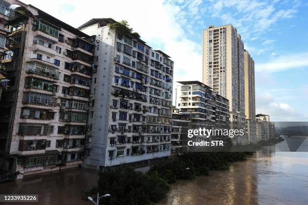 This photo taken on July 11, 2021 shows a street outside buildings flooded after heavy rains in Dazhou, in China's southwestern Sichuan province. -...