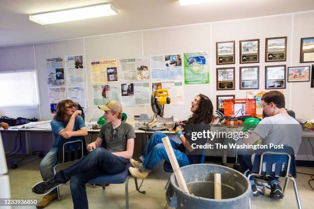 Summer experience participants Paul Signet from left, Philip Wilson Madison Jaminet and Aidan Magner share a laugh in the classroom trailer at the...