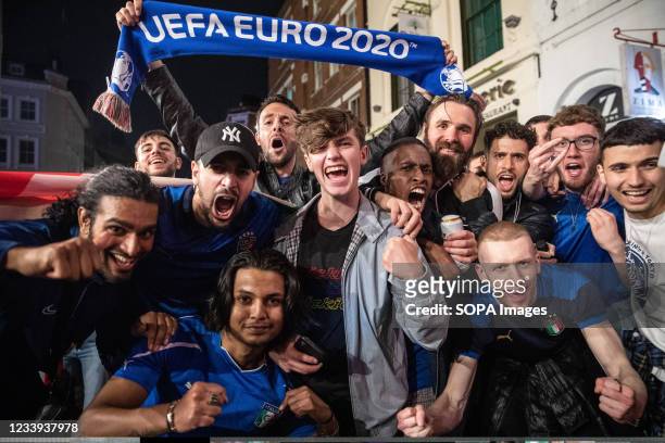 Italian fans pose for photos during the celebration after the UEFA Euro Final outside an Italian bar. Italy's men's team claimed victory over England...