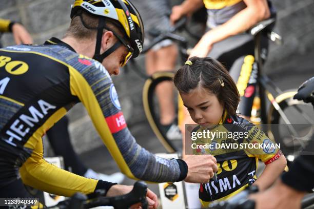 Dutch Steven Kruijswijk of Team Jumbo-Visma signs an autographes for a young fan during the second rest day of the 108th edition of the Tour de...