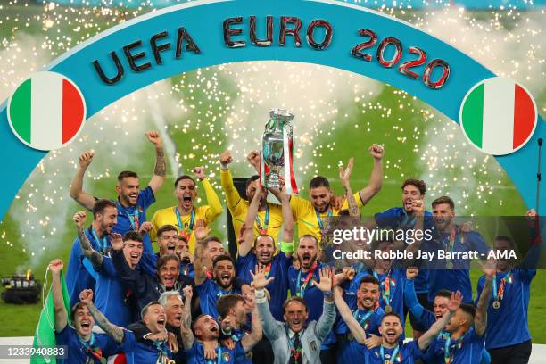 Giorgio Chiellini of Italy celebrates winning EURO 2020 by lifting the trophy aloft with team mates during the UEFA Euro 2020 Championship Final...