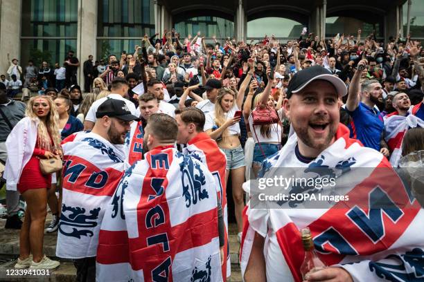 Football fans draped in St Georges flags descend into the city to watch the Euro 2020 final, which saw England get beaten by Italy during the...