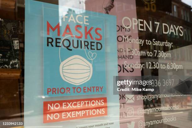 Masks required, no exceptions sign in a shop window on 2nd July 2021 in London, United Kingdom. Now that the roadmap for coming out of the national...