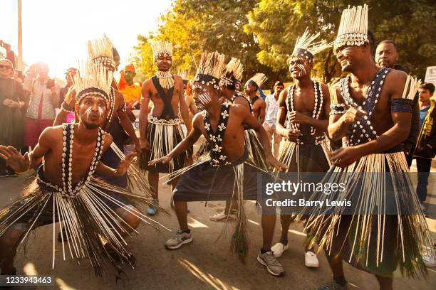 Young Rajasthani men dressed in African tribal wear at the Desert Festival on 29th January in Jaisalmer, Rajasthan, India. It is an annual event that...