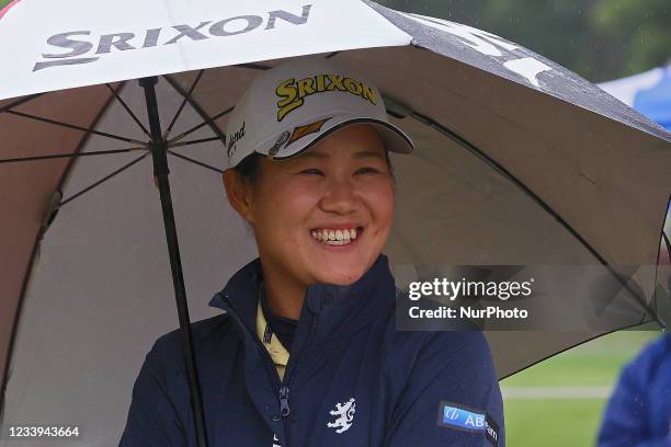 Nasa Hataoka of Ibaraki, Japan smiles at fans in the rain during the awards ceremony during the final round of the Marathon LPGA Classic golf...