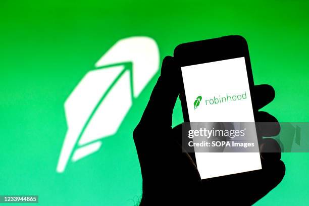 In this photo illustration, a Robinhood Markets logo seen displayed on a smartphone.