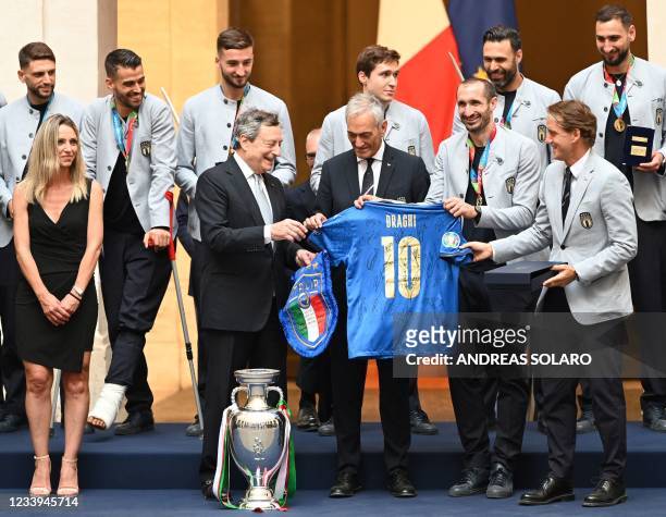 Italy's coach Roberto Mancini , Italy's defender Giorgio Chiellini and President of the Italian Football Federation , Gabriele Gravina present...