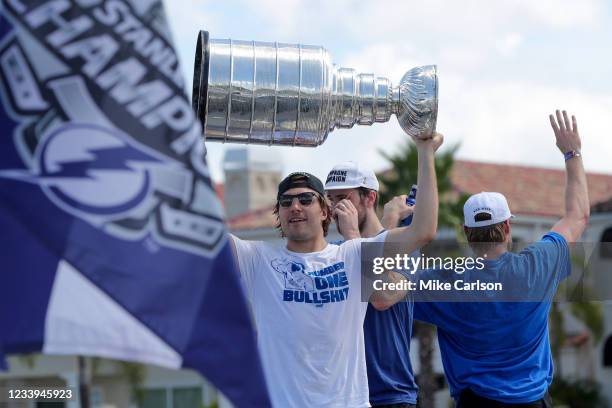 Luke Schenn of the Tampa Bay Lightning raises the Stanley Cup during the boat parade to celebrate the Tampa Bay Lightning winning the Stanley Cup...