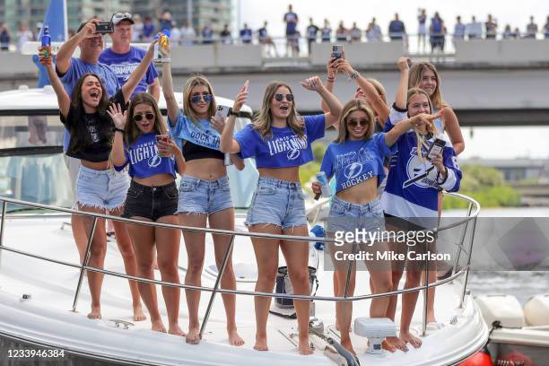 Fans celebrate during the boat parade to celebrate the Tampa Bay Lightning winning the Stanley Cup July 12, 2021 in Tampa, Florida.