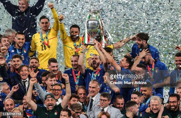 Leonardo Bonucci of Italy lifts the trophy and celebrates with team mates during the UEFA Euro 2020 Championship Final between Italy and England at...