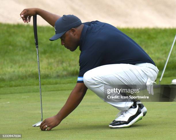 Harold Varner III places his ball on the green during the first round of the John Deere Classic on July 08 at TPC Deere Run, Silvis, IL. ,