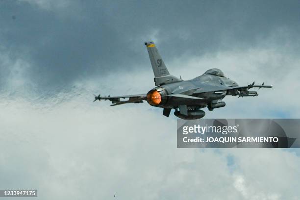 Air Force F-16 aircraft flies near the Rionegro Airport during military drills between the Colombia and the United States Air Forces in Rionegro,...