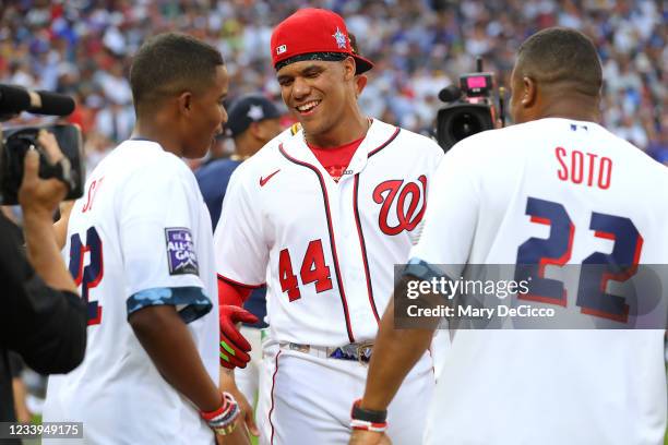 Juan Soto of the Washington Nationals is congratulated by family after the first round during the 2021 T-Mobile Home Run Derby at Coors Field on...