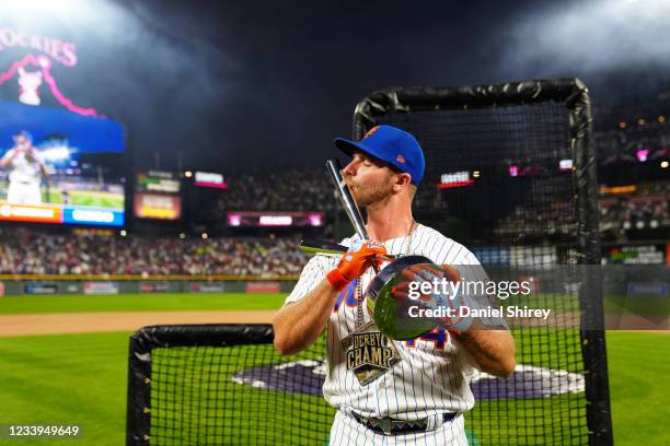 Pete Alonso of the New York Mets celebrates winning his second straight home run derby title during the 2021 T-Mobile Home Run Derby at Coors Field...