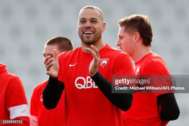 Lance Franklin of the Swans shares a joke during the Sydney Swans training session at Lakeside Stadium on July 13, 2021 in Melbourne, Australia.