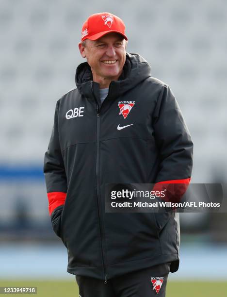 John Longmire, Senior Coach of the Swans looks on during the Sydney Swans training session at Lakeside Stadium on July 13, 2021 in Melbourne,...