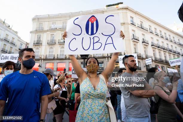 Dozens of people during demonstration i in support of the protests in Cuba, in front of the Cuban embassy in Spain, on July 12 in Madrid . Fo to...