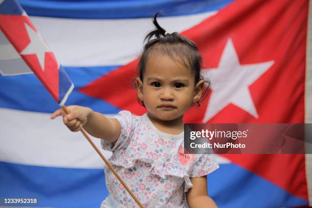 Girl belonging to the Mexican Movement of Solidarity with Cuba and Cubans Residing in Mexico, demonstrated outside the Cuban Embassy in Mexico City...