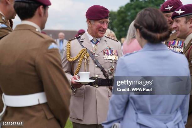 Prince Charles, Prince of Wales speaks to Paras, families and veterans after a ceremony to present new colours to the Parachute Regiment at Merville...