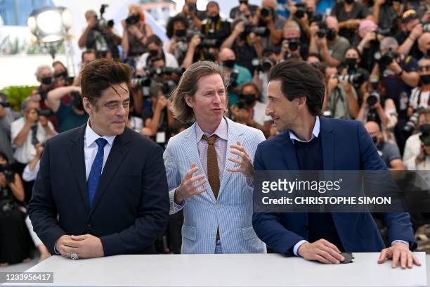 Us actor Benicio Del Toro, Us director Wes Anderson and Us actor Adrien Brody pose during a photocall for the film "The French Dispatch" at the 74th...