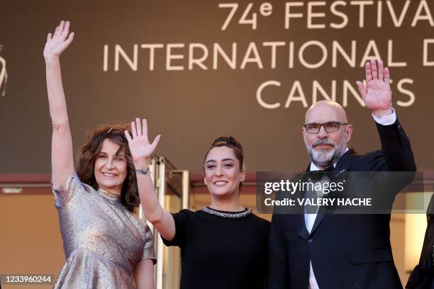 French actress and director Valerie Lemercier, French singer Victoria Sio and Canadian actor Sylvain Marcel waves upon their arrival for the...