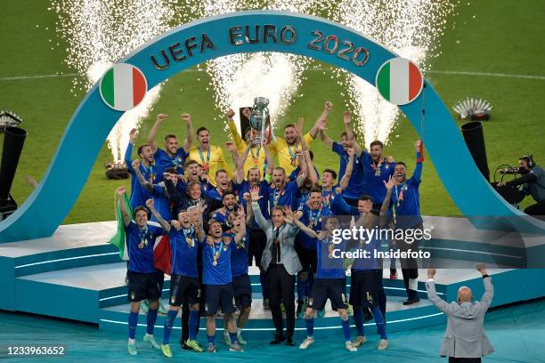 Roberto Mancini coach of Italy and the italian players celebrate the victory during the prize ceremony at the end of the Uefa Euro 2020 Final...