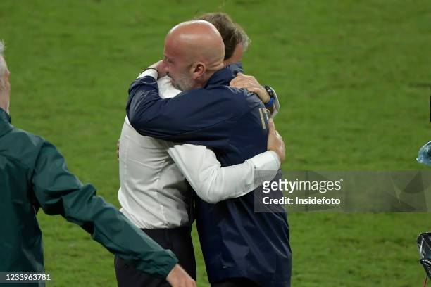 Roberto Mancini, coach of Italy, and his former Sampdoria team mate Gianluca Vialli celebrate the victory at the end of the Uefa Euro 2020 Final...